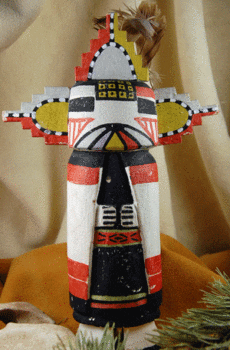 Sentence with replaced product name: Colorful hand-painted Hopi Butterfly Kachina with elaborate patterns, displayed against a draped cloth background.