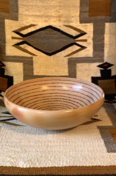 A bowl sitting on top of a rug.
