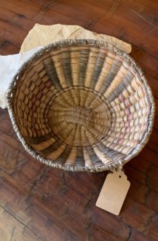 A basket sitting on top of the floor.