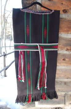 A black and red blanket with green stripes