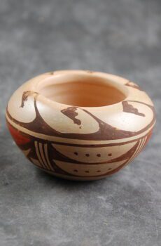 A small bowl with a design on it