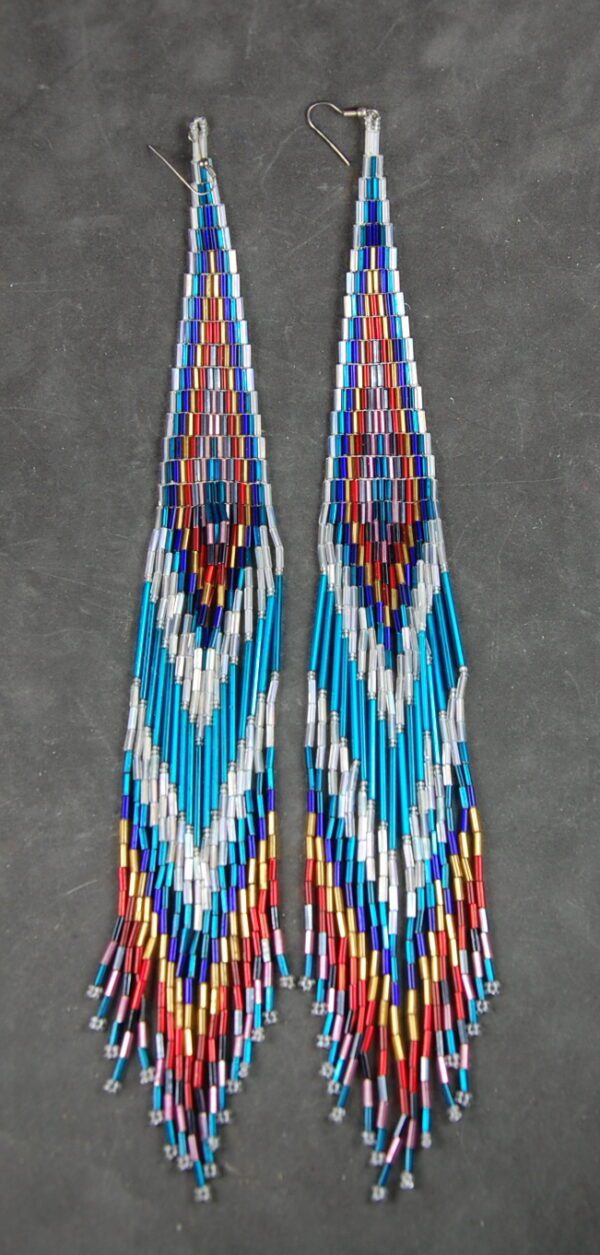 A pair of long beaded earrings in blue, red and white.