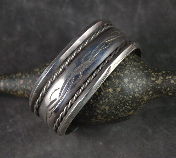 A silver ring with some metal on it