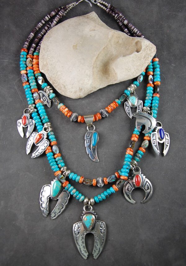 A necklace with feathers and beads on it