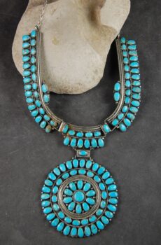 A necklace with turquoise stones on it